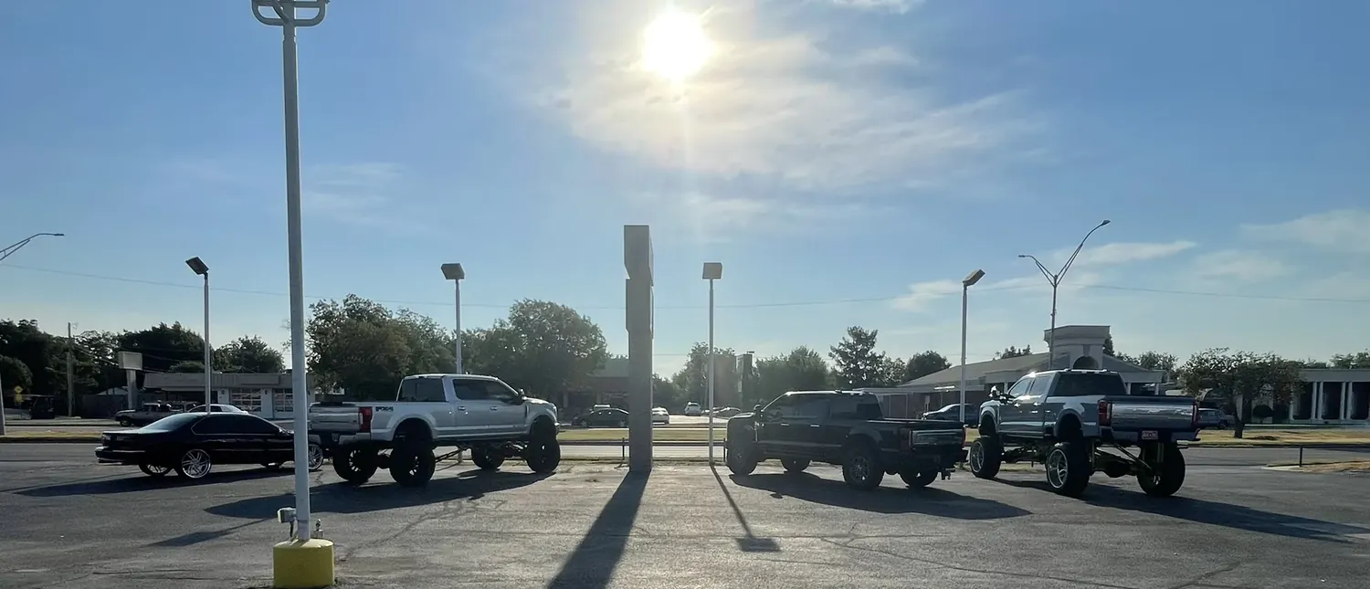 Lifted trucks in the lot at the Broadway Auto Collective, 909 S. Broadway, Edmond Oklahoma